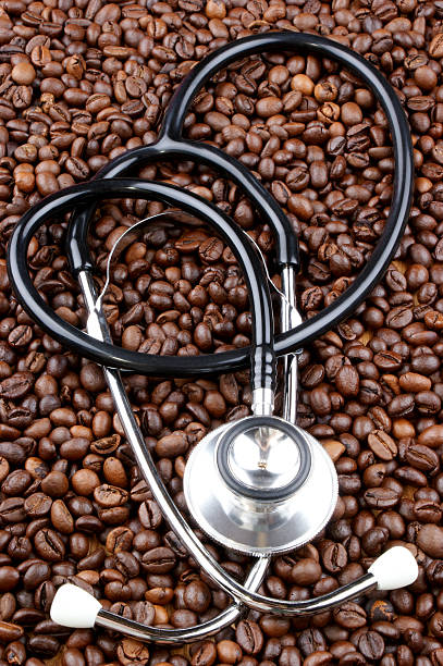 istock freshly roasted coffee beans and a stethoscope 153491318