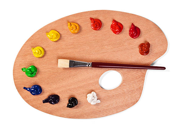 Paint palette with clean brush and fresh paints