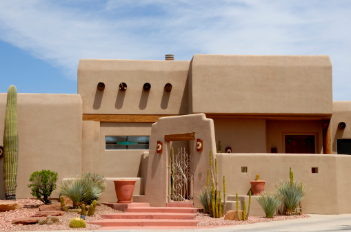 A close up of a nicely landscaped home of the southwest adobe style just outside of Las Vegas, Nevada near the Lake Mead resort.