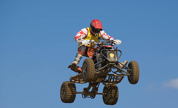 istock Quadbike jumping really high 153491526