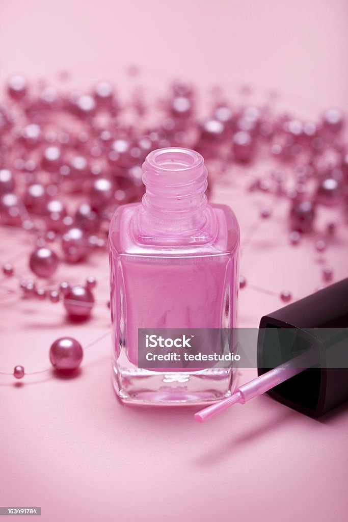 Pink nail polish Pink nail polish on pink background Beauty Product Stock Photo