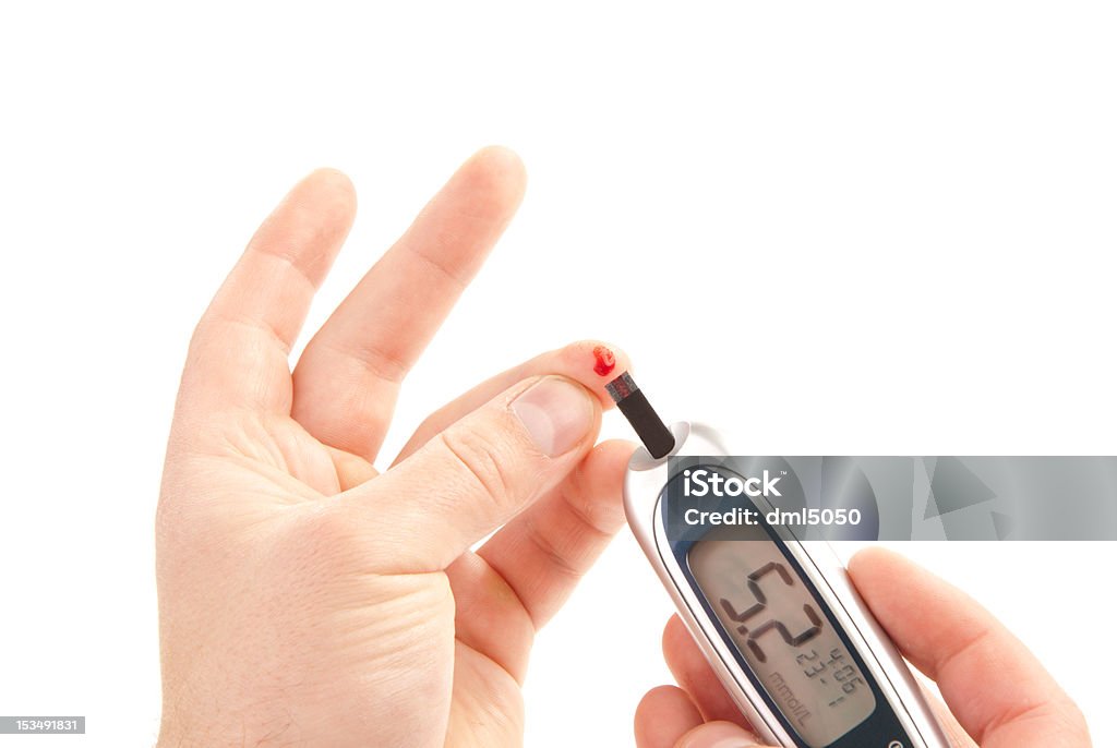 diabetes measuring glucose level blood test Dependent first type Diabetic patient measuring glucose level blood test using ultra mini glucometer and small drop of blood from finger and test strips on a white background Blood Stock Photo