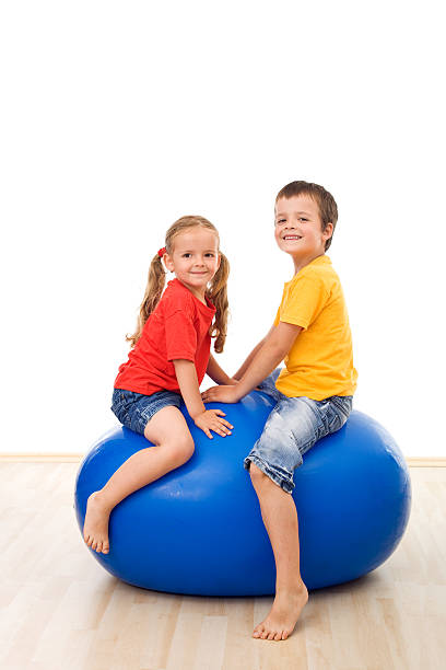 istock Kids having fun playing with a large ball 153491846