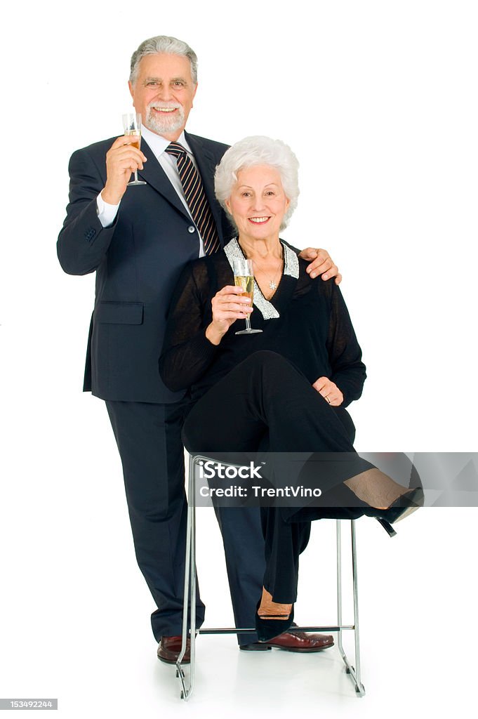 Elegante casal de idosos brindando - Foto de stock de 70 anos royalty-free