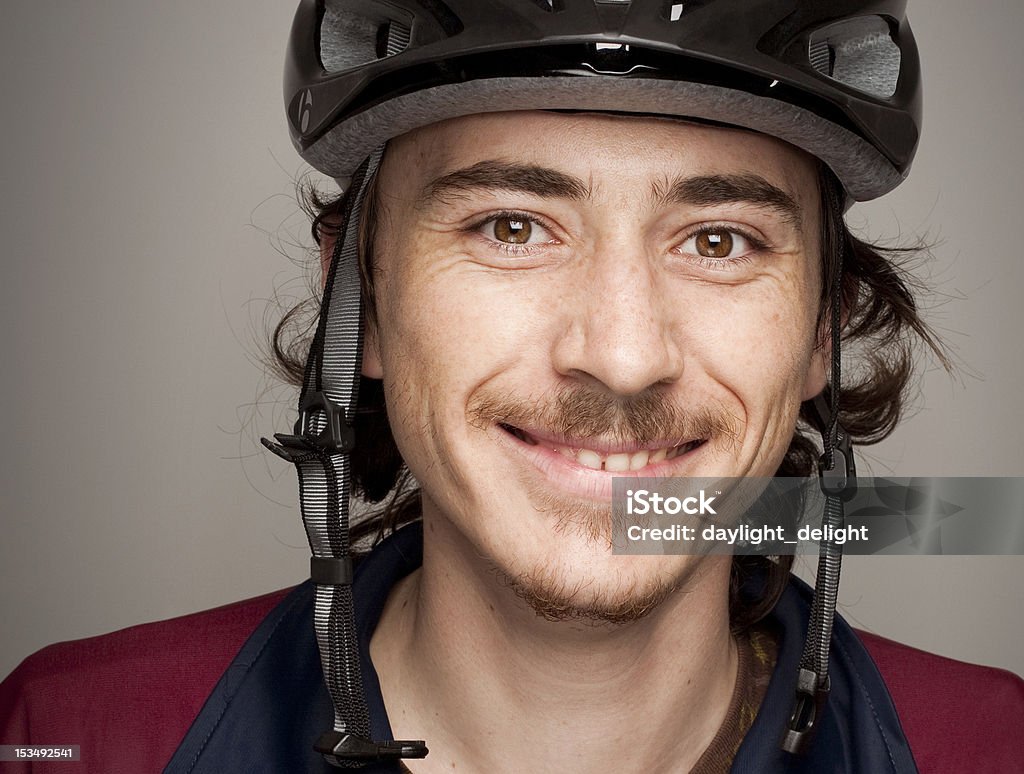 Young Man Smiling and wearing Bycicle Helmet Protection Trustworthy Young Man Smiling and wearing Bycicle Helmet Protection Adolescence Stock Photo