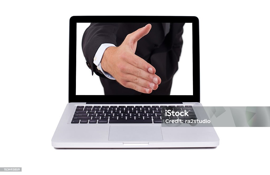 Ręka wydobywającego się z ekranu laptopa - Zbiór zdjęć royalty-free (Komputer)
