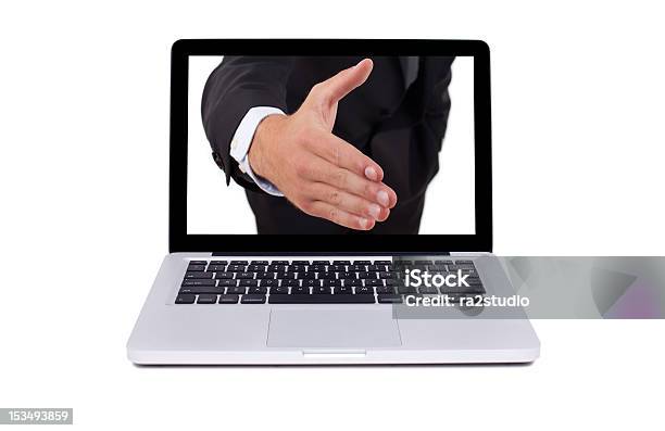 Foto de Mão Que Vem Da Tela Do Laptop e mais fotos de stock de Computador - Computador, Cumprimentar, Dar as Mãos