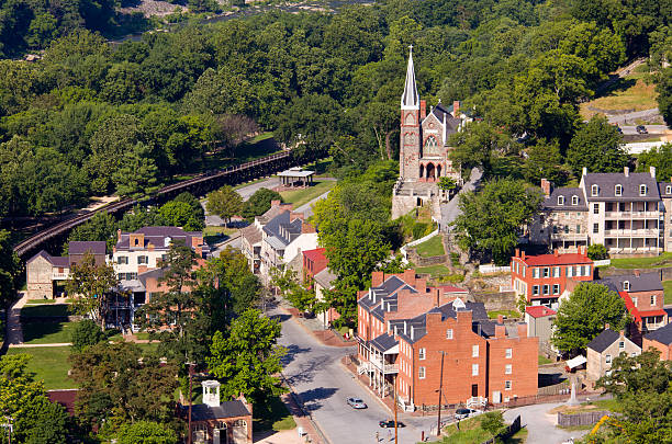 An aerial view of the Harper's Ferry National Park Aerial view over the National Park town of Harpers Ferry in West Virginia with the church and old buildings in the city harpers ferry photos stock pictures, royalty-free photos & images