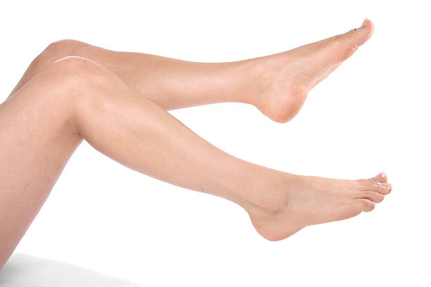 istock Woman legs over white 153494862