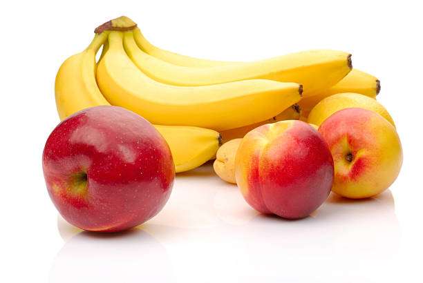 istock red and yellow fresh fruits isolated on white 153494918