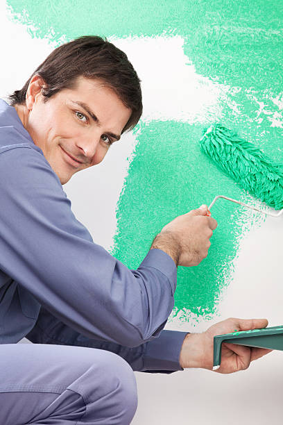 istock Handsome man painting house 153494935