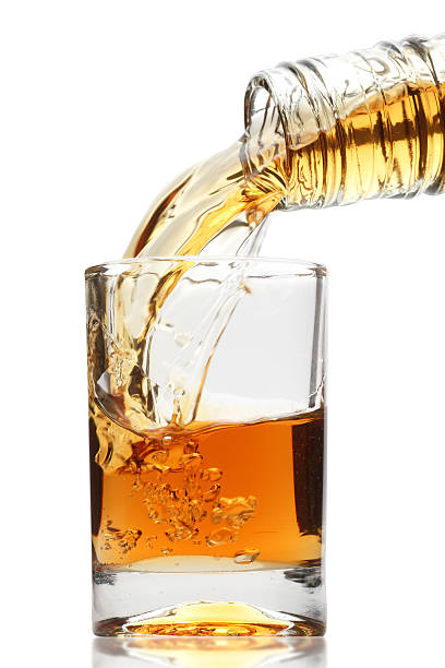 istock whiskey being poured into a glass 153495156
