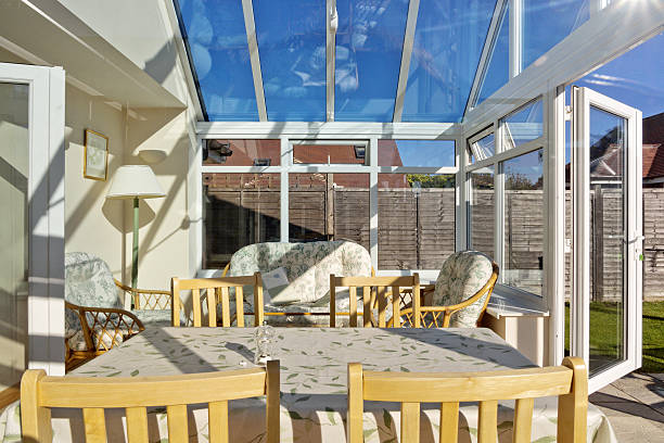 Open air conservatory with tables and yellow chairs