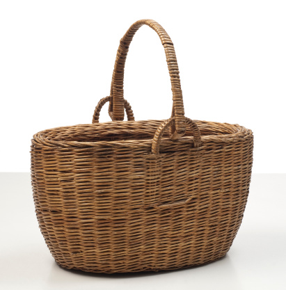 Wicker basket isolated on white background. Clipping path included.