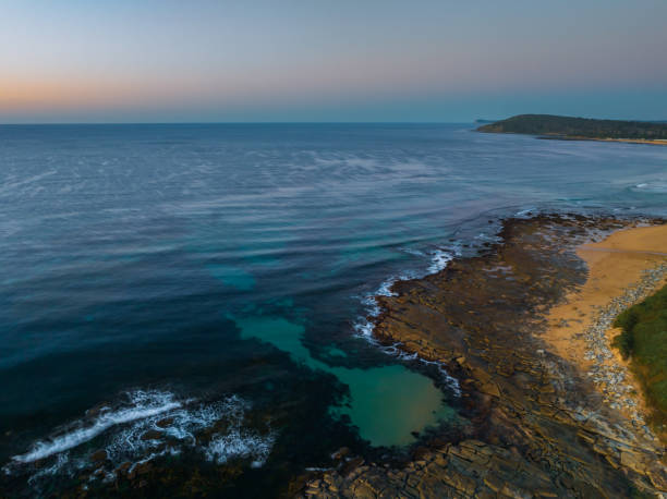 istock Sunrise over the ocean with clouds 1534961125