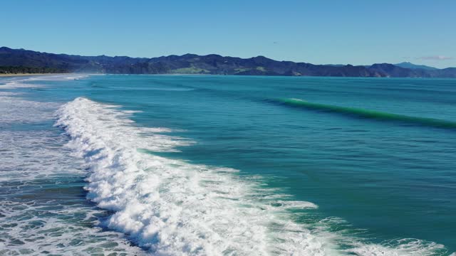 New Zealand Beach, waves crashing created whitewash
