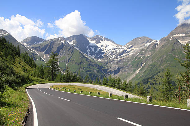 istock Beautiful Alpine road during summer 153496525
