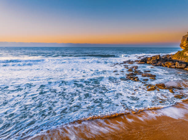 istock Sunrise and waves at the seaside 1534969749
