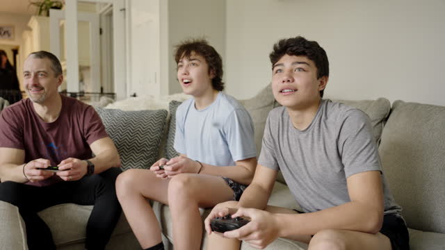 Family having fun at home playing video games