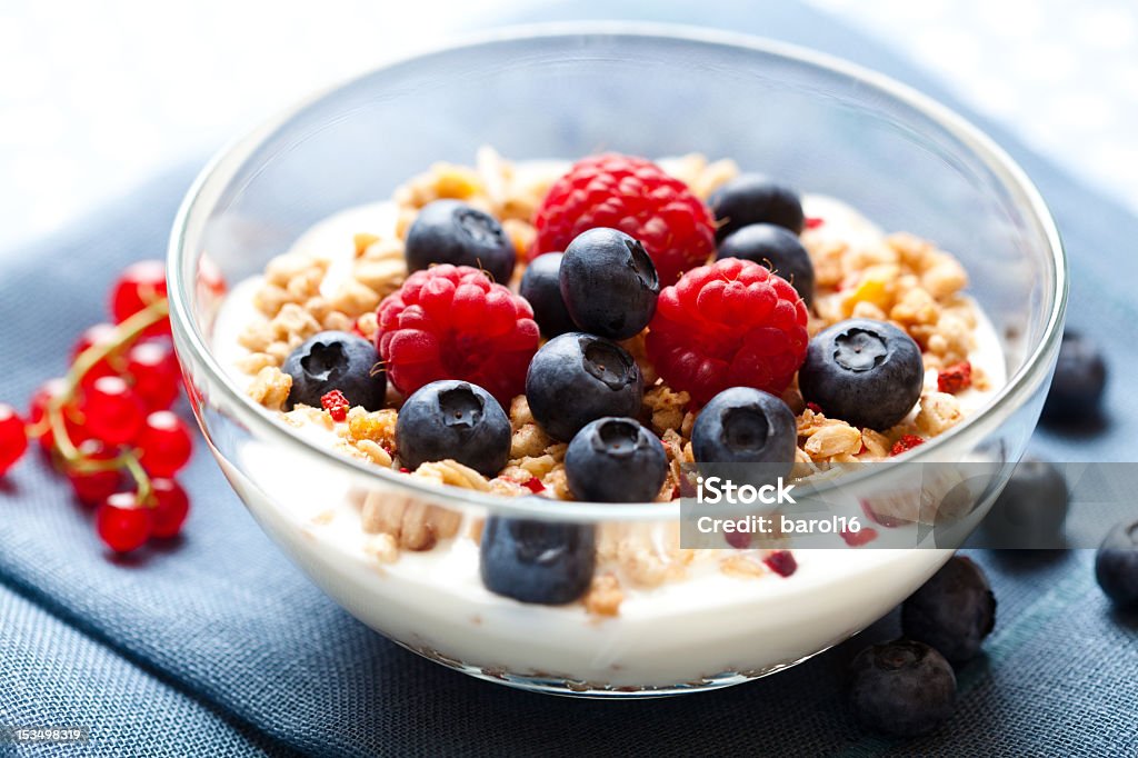 Crunchy muesli with yogurt and berries close up of crunchy muesli with yogurt and fresh fruits Blueberry Stock Photo