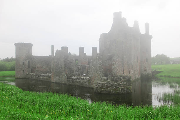 istock Caerlaverock castle taken in deep fog 153498888
