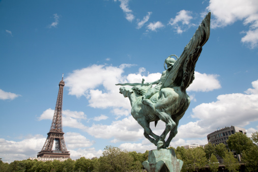 Paris  - Eiffel tower and statue of Joan of Arc by Holger Wendekinch