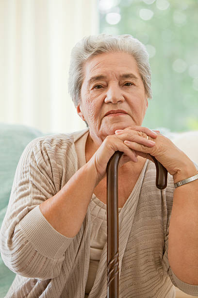istock Senior woman with her walking stick 153499202