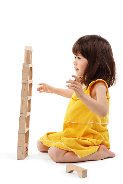 Little Girl Playing With Building Blocks - Isolated