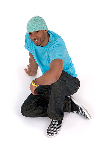 istock Relaxed young man sitting on the floor 153499715