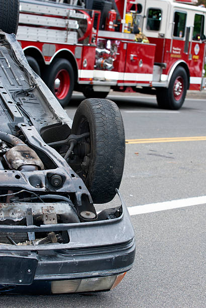 istock OverturnedCarandFireTruck 153500157