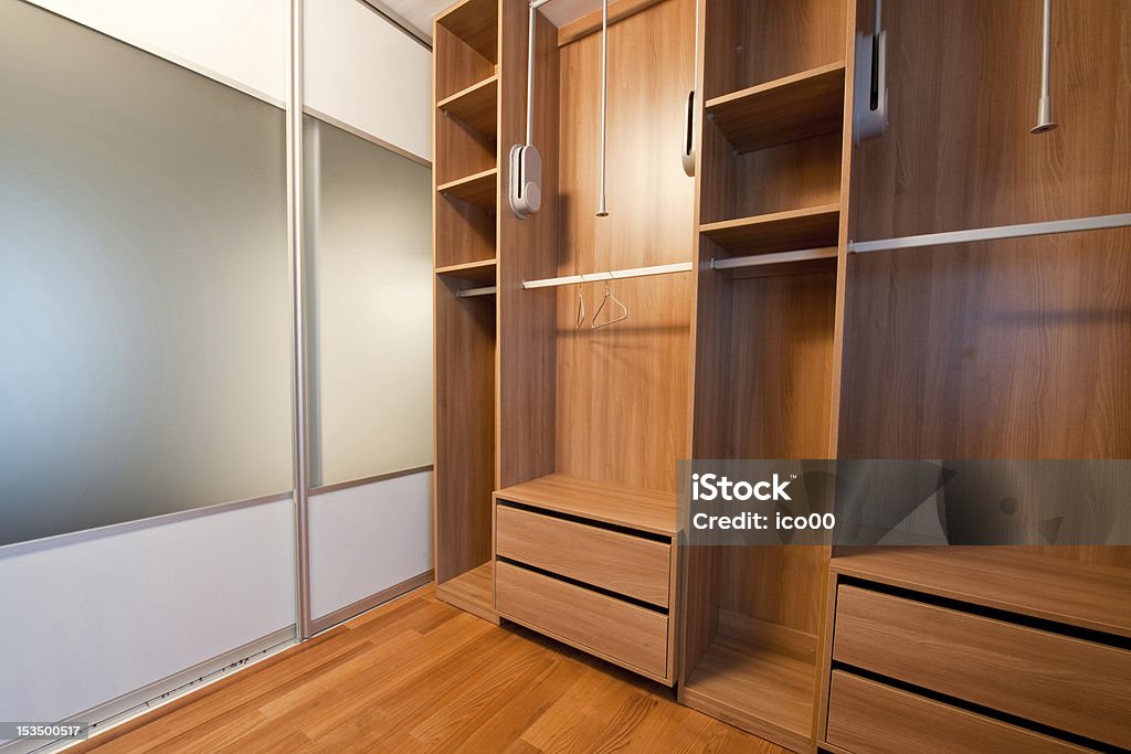 Inside of walk-in wardrobe Inside of big modern walk-in wardrobe Box - Container Stock Photo