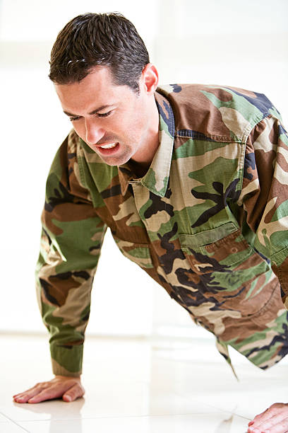 istock White male in army uniform doing a push up 153501112