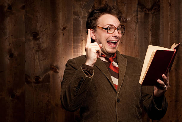 istock Nerdy man in brown with glasses and book having idea. 153501161