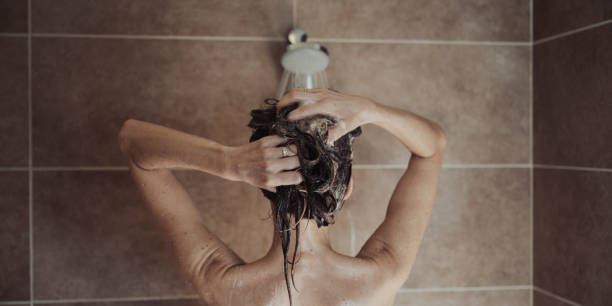 istock View from behind of a woman showering 1535016192