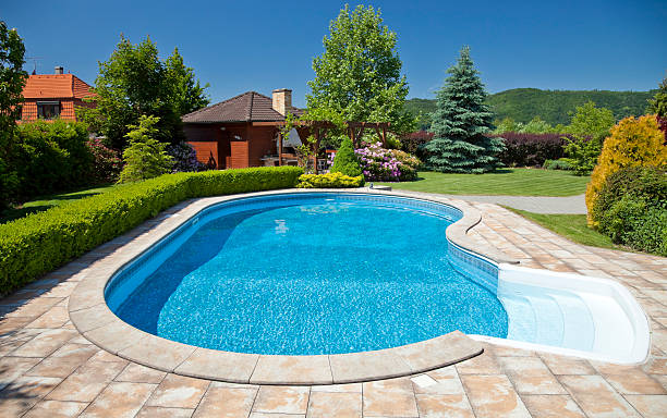 Odd shape pool on a sunny clear day stock photo