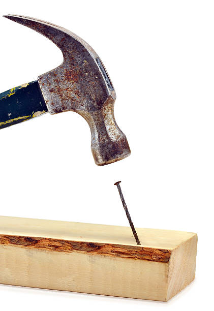 istock Hammer hitting nail on the head 153502066