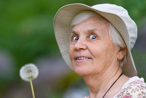 istock Women with flowers dandelion 153502264