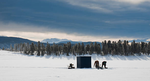 Ice fishing Ice fishing on Lake Granby, Colorado. ice lakes colorado stock pictures, royalty-free photos & images