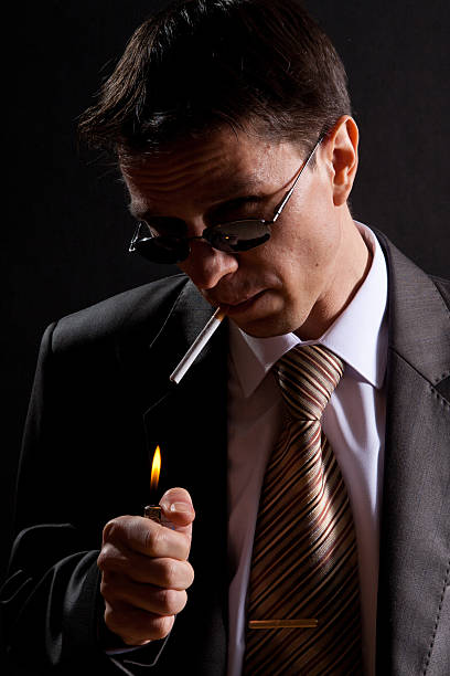 istock Smoking Bussinesman with glasses looking at you 153503353