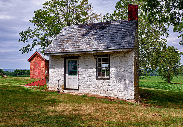 istock Old white house on farmland 153504947