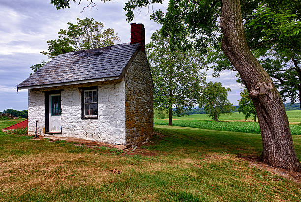 istock Old white house on farmland 153504949