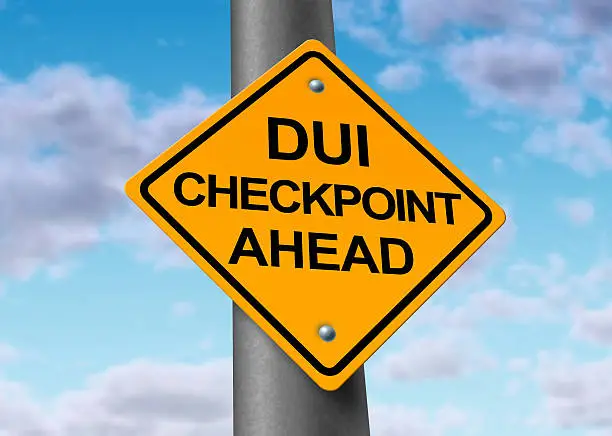 Sobriety and drunk driving checkpoint representing the dangers of drivers that are intoxicated above the legal limit by alcohol or other drugs while they are behind the wheel of a vehicule.
