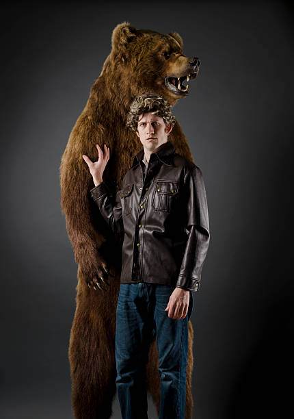 istock Serious Man Standing With His Grizzly Bear 153505578