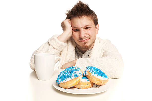 istock Morning donuts and man shot on white 153505687