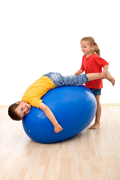 istock Kids having fun playing with a large rubber ball 153505755
