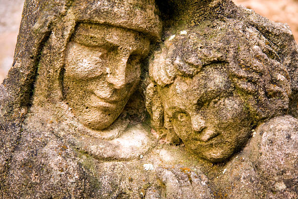 Medieval statue of a mother and child in Castle Fenelon in Dordogne, France