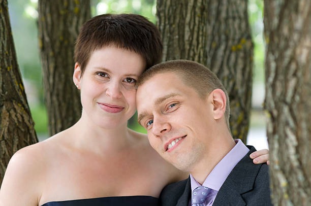 istock Portrait of young couple under a tree 153507224