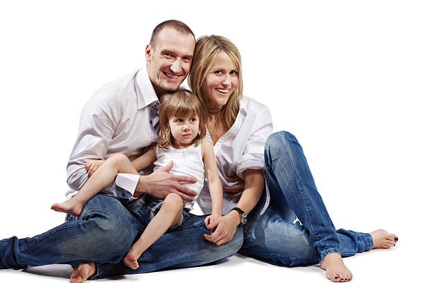 istock Family of three persons sits on floor. 153508515