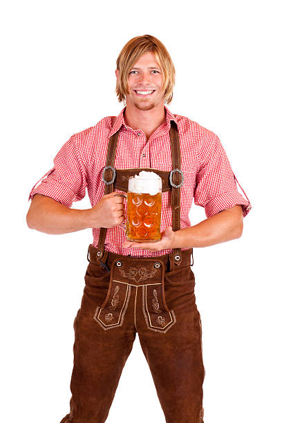 Happy smiling man with lederhose holds Beer Fest beer stein stock photo