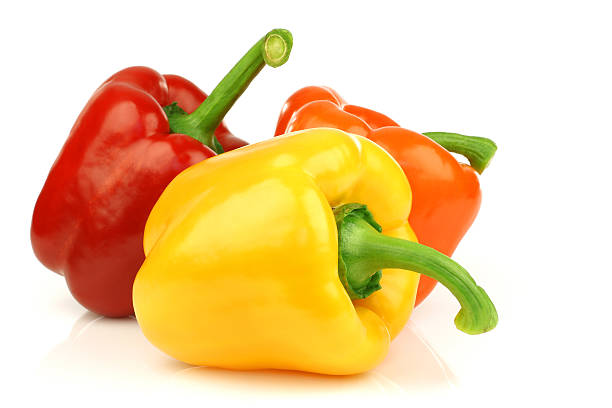 istock Red, orange and yellow paprika on a white background 153509338